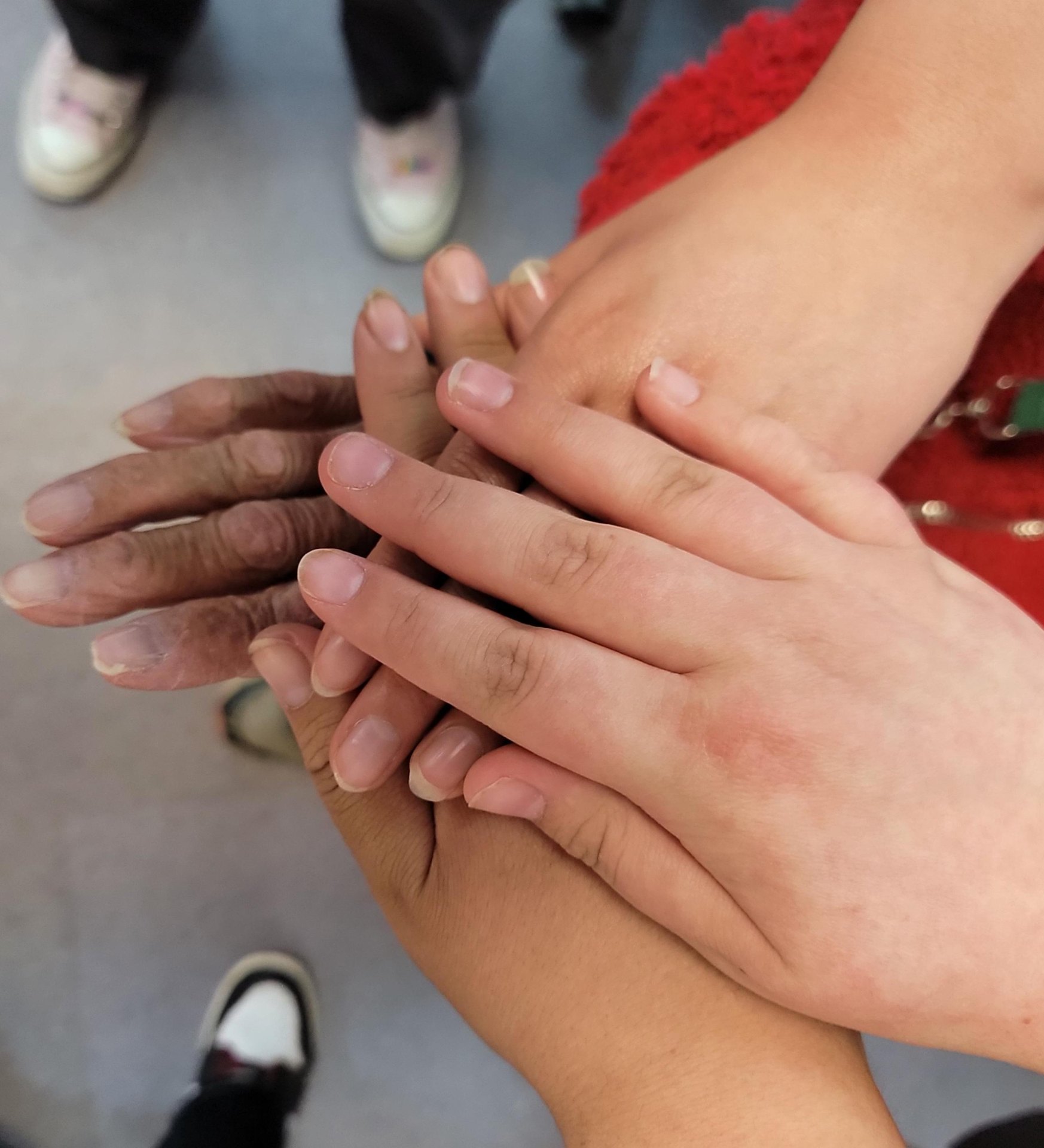 Hands of community members joined together